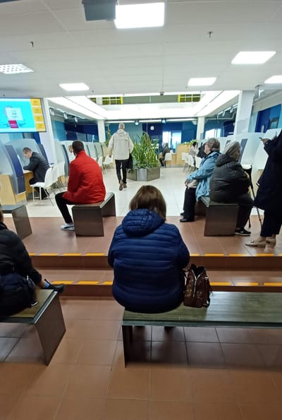 Waiting in line to complete my visa application.